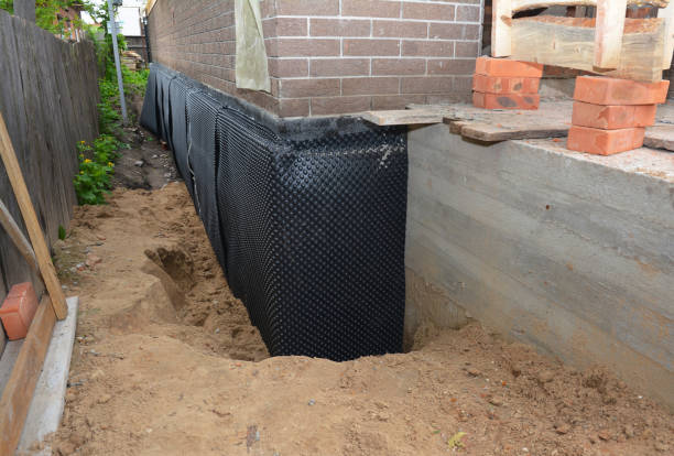 Happy homeowners after waterproofing job in Harbert